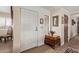 Welcoming foyer featuring a decorative table, stylish décor, and hardwood floors at 36801 N Long Rifle Rd, Carefree, AZ 85377