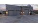 Three car garage with exterior lighting at 36801 N Long Rifle Rd, Carefree, AZ 85377