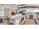 Open kitchen featuring granite countertops, stainless steel appliances, and bright white cabinetry at 36801 N Long Rifle Rd, Carefree, AZ 85377
