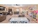 Expansive living area with wood-look floors, comfortable seating, and ample space for and Gathering activities at 36801 N Long Rifle Rd, Carefree, AZ 85377