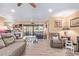 Open-concept living area with hardwood floors, comfortable seating, and easy access to the patio for seamless indoor-outdoor living at 36801 N Long Rifle Rd, Carefree, AZ 85377
