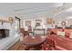 Comfortable living room with a fireplace and stylish furnishings; perfect for relaxation at 36801 N Long Rifle Rd, Carefree, AZ 85377