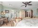 A luxurious main bedroom featuring a desk area and doorway into the ensuite bathroom at 36801 N Long Rifle Rd, Carefree, AZ 85377