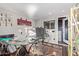 This home office features a modern glass desk, contemporary decor, and a convenient entryway to the rest of the home at 36801 N Long Rifle Rd, Carefree, AZ 85377