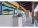 Outdoor grill with stone counter top for easy backyard entertaining at 36801 N Long Rifle Rd, Carefree, AZ 85377