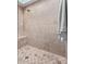 Neutral tiled walk-in shower with built-in bench seating at 36801 N Long Rifle Rd, Carefree, AZ 85377