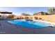 Large backyard swimming pool with desert landscaping and lounge chairs at 36801 N Long Rifle Rd, Carefree, AZ 85377
