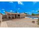 Well-maintained backyard featuring gravel landscaping, covered patio and refreshing pool at 3814 W El Camino Dr, Phoenix, AZ 85051