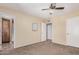 The bedroom has a ceiling fan and has a sign that says 