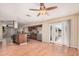 Open-concept kitchen boasts stainless steel appliances, a center island, and bright, sunny doors to the outside at 3814 W El Camino Dr, Phoenix, AZ 85051
