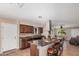 Well-designed kitchen features a large island with seating and rich countertops, plus a stylish vent hood at 3814 W El Camino Dr, Phoenix, AZ 85051