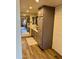 Bathroom with wood-look floors, dual sinks, granite counters and ample storage at 4303 E Cactus Rd # 235, Phoenix, AZ 85032