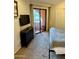Cozy bedroom with balcony access featuring a dresser, closet, and neutral color scheme at 4303 E Cactus Rd # 235, Phoenix, AZ 85032