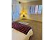 Inviting bedroom features a plush carpet, cozy queen bed and window with shutters at 4303 E Cactus Rd # 235, Phoenix, AZ 85032