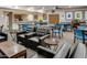 Inviting community room with comfortable seating, tables, and a kitchenette for social gatherings at 4303 E Cactus Rd # 235, Phoenix, AZ 85032