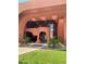 Unique building exterior with glass entry, well-kept landscaping, and a welcoming entrance at 4303 E Cactus Rd # 235, Phoenix, AZ 85032