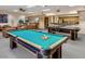 Community game room featuring a pool table, ping pong table, and bar area at 4303 E Cactus Rd # 235, Phoenix, AZ 85032