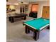 Community game room featuring a pool table, ping pong table, and comfortable seating area at 4303 E Cactus Rd # 235, Phoenix, AZ 85032