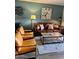 Comfortable living space with a leather sofa, chairs, and stylish coffee table at 4303 E Cactus Rd # 235, Phoenix, AZ 85032