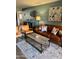 Cozy living room featuring a stylish rug, warm lighting, and comfortable seating arrangement at 4303 E Cactus Rd # 235, Phoenix, AZ 85032