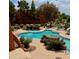Resort-style pool with waterfalls and lounge seating offers a relaxing outdoor oasis at 4303 E Cactus Rd # 235, Phoenix, AZ 85032