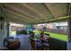 Covered back porch with artificial grass at 4323 W Rose Ln, Glendale, AZ 85301