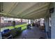 Covered back porch with artificial grass view at 4323 W Rose Ln, Glendale, AZ 85301