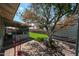 A brick patio and artificial turf backyard at 4323 W Rose Ln, Glendale, AZ 85301