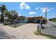 Charming single story home with a covered carport, mature landscaping, and a classic chain-link fence at 4323 W Rose Ln, Glendale, AZ 85301