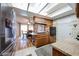 Cozy eat-in kitchen featuring wood cabinets, a kitchen island, and access to the backyard at 4323 W Rose Ln, Glendale, AZ 85301