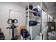 Laundry room with storage shelving and exercise equipment at 4323 W Rose Ln, Glendale, AZ 85301