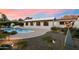 Beautiful backyard with pool, desert landscaping, and an artistic metal sculpture at 5822 N 44Th Pl, Phoenix, AZ 85018
