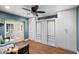 Comfortable bedroom with built-in closets, providing ample storage and a cozy atmosphere, with views of the patio at 5822 N 44Th Pl, Phoenix, AZ 85018