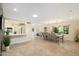 Open-concept dining area with modern lighting, neutral tones, and tiled floors at 5822 N 44Th Pl, Phoenix, AZ 85018