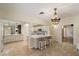 Spacious kitchen island with stool seating, chandelier, and pendant lighting at 5822 N 44Th Pl, Phoenix, AZ 85018