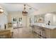 Bright kitchen with island seating, patio views and an adjacent breakfast nook at 5822 N 44Th Pl, Phoenix, AZ 85018