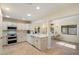 Bright kitchen with white cabinetry, stainless steel appliances, and tile floors at 5822 N 44Th Pl, Phoenix, AZ 85018