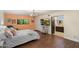 Bright main bedroom featuring wood floors, a chandelier, and an ensuite bathroom at 5822 N 44Th Pl, Phoenix, AZ 85018