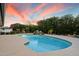 Sparkling pool with waterfall, mature landscaping, and beautiful deck at 5822 N 44Th Pl, Phoenix, AZ 85018
