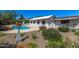 Pool area with desert landscaping, sculpture and mountain views at 5822 N 44Th Pl, Phoenix, AZ 85018
