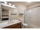 Clean bathroom with vanity, framed mirror, and step-in shower at 6614 S Mckemy St, Tempe, AZ 85283