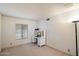 Bright room featuring a window, carpet, and a desk at 6614 S Mckemy St, Tempe, AZ 85283