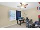 Bedroom featuring a ceiling fan and desk area, great for a home office at 6926 W Comet Ave, Peoria, AZ 85345