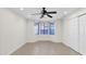Bright bedroom with tile floors, a ceiling fan, and ample natural light at 6926 W Comet Ave, Peoria, AZ 85345