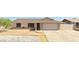 Charming single-story home featuring a well-maintained front yard and a two-car garage at 6926 W Comet Ave, Peoria, AZ 85345