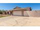 Spacious two-car garage with a wide driveway providing ample parking space at 6926 W Comet Ave, Peoria, AZ 85345