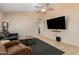 Bright living room with a vaulted ceiling, large TV, and access to the other rooms of the house at 6926 W Comet Ave, Peoria, AZ 85345