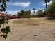 Large back yard featuring desert landscaping, minimal green space, and privacy fence at 7702 W Piute Ave, Glendale, AZ 85308