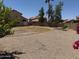 Spacious back yard featuring desert landscaping and a privacy fence at 7702 W Piute Ave, Glendale, AZ 85308