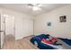 Bright bedroom with light wood floors and white walls, perfect for a room at 7702 W Piute Ave, Glendale, AZ 85308